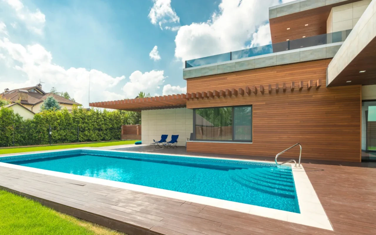 Modern outdoor swimming pool integrated into a contemporary home