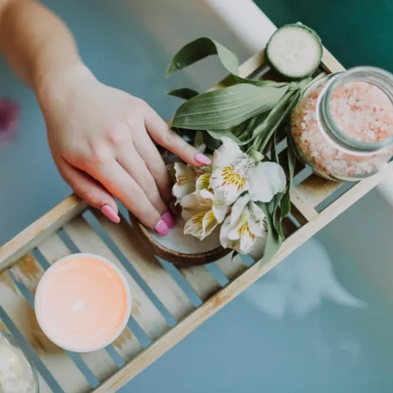Wellness ritual with candle and accessories placed on water